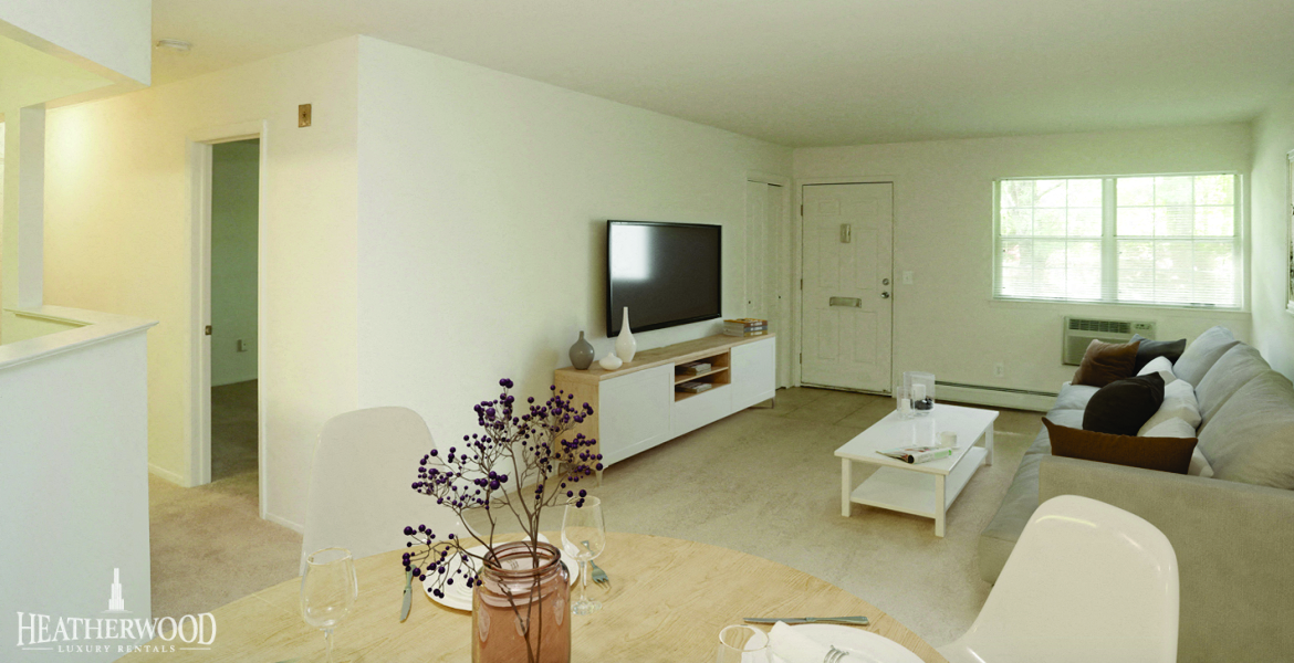 living room set with wide screen tv at Villas at Pine Hills, Manorville, 11949